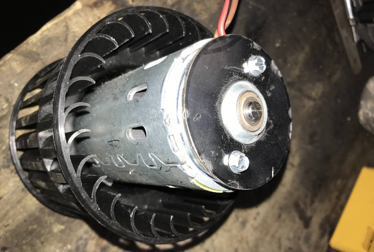 Flat piece screwed to motor