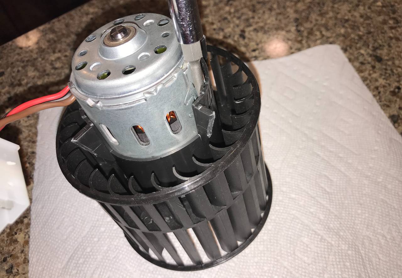 Break away blower motor housing with a screw driver